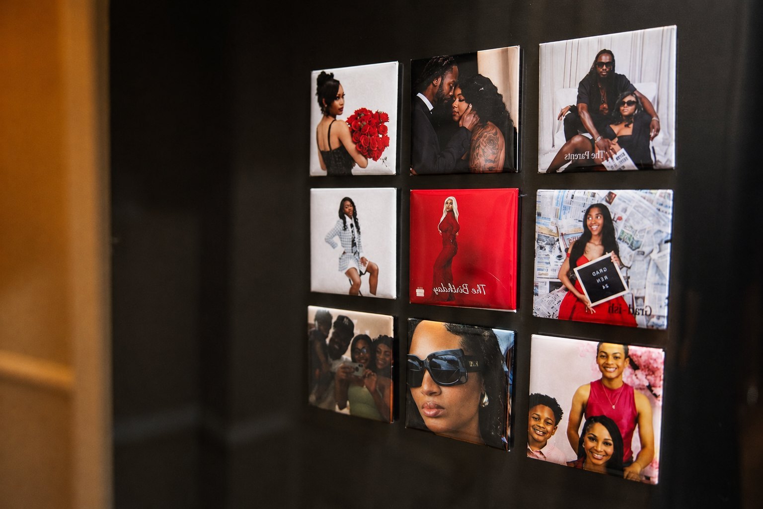 A refrigerator door covered with FORVR photo magnets of family moments